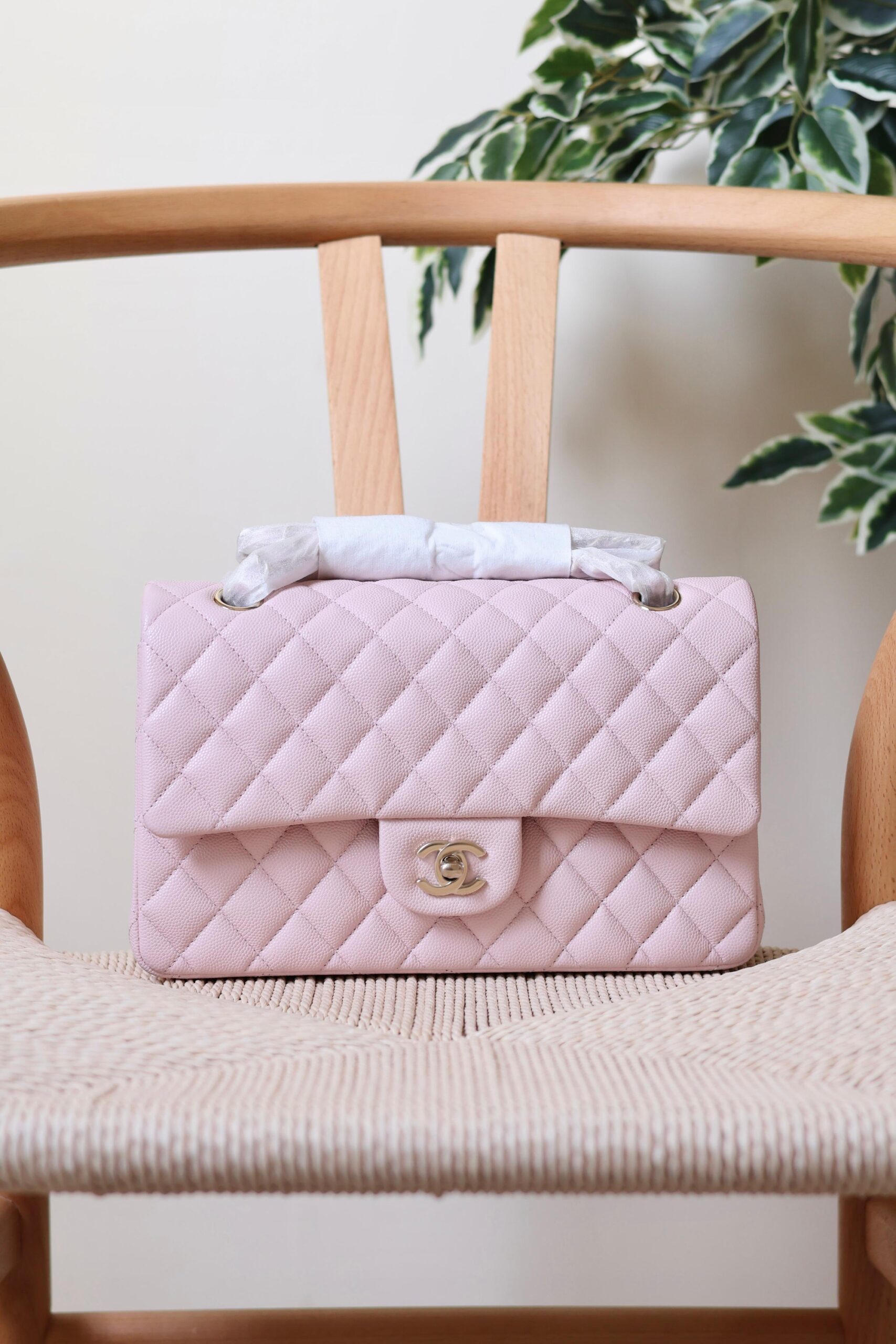 Chanel Classic Flap Bag Caviar Leather And Features A Silver Tone CC Turn-Lock